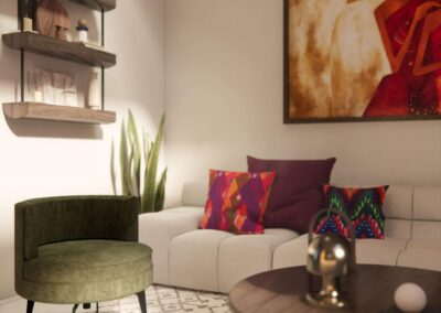 A modern sofa with colorful pillows and a bold cultural art piece above it.