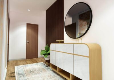 Modern entryway featuring a curved wood-and-white console, a round mirror, and subtle decor.